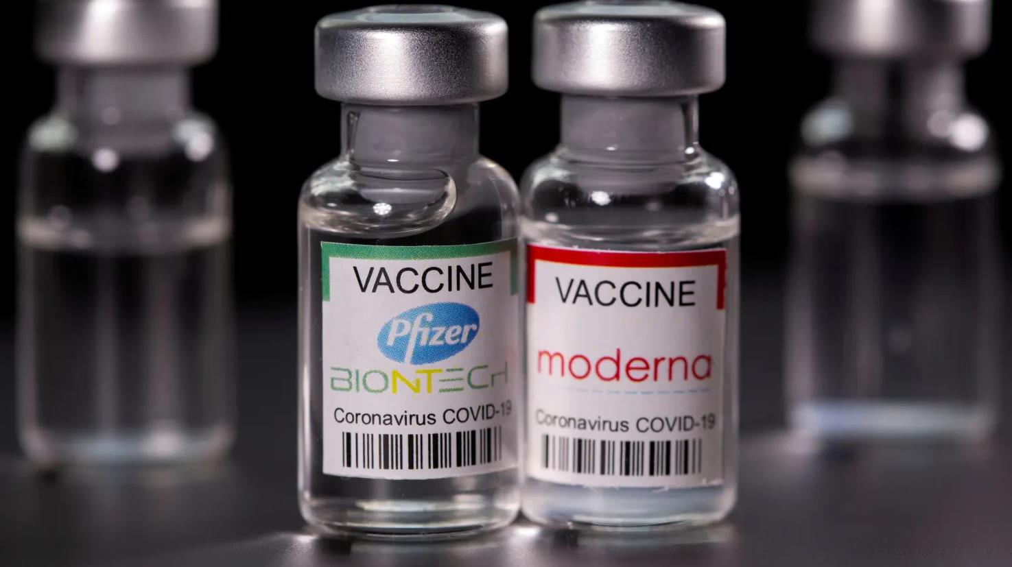 Vials with Pfizer-BioNTech and Moderna coronavirus disease (COVID-19) vaccine la.jpg